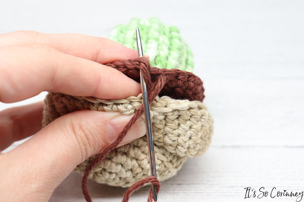 Insert The Yarn Needle Into The First Stitch Of The Soil