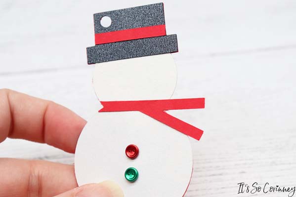 Tape The Scarf Onto The Snowman