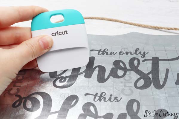 Use Cricut Scraper To Push The Vinyl Onto Holy Ghost Fall Sign